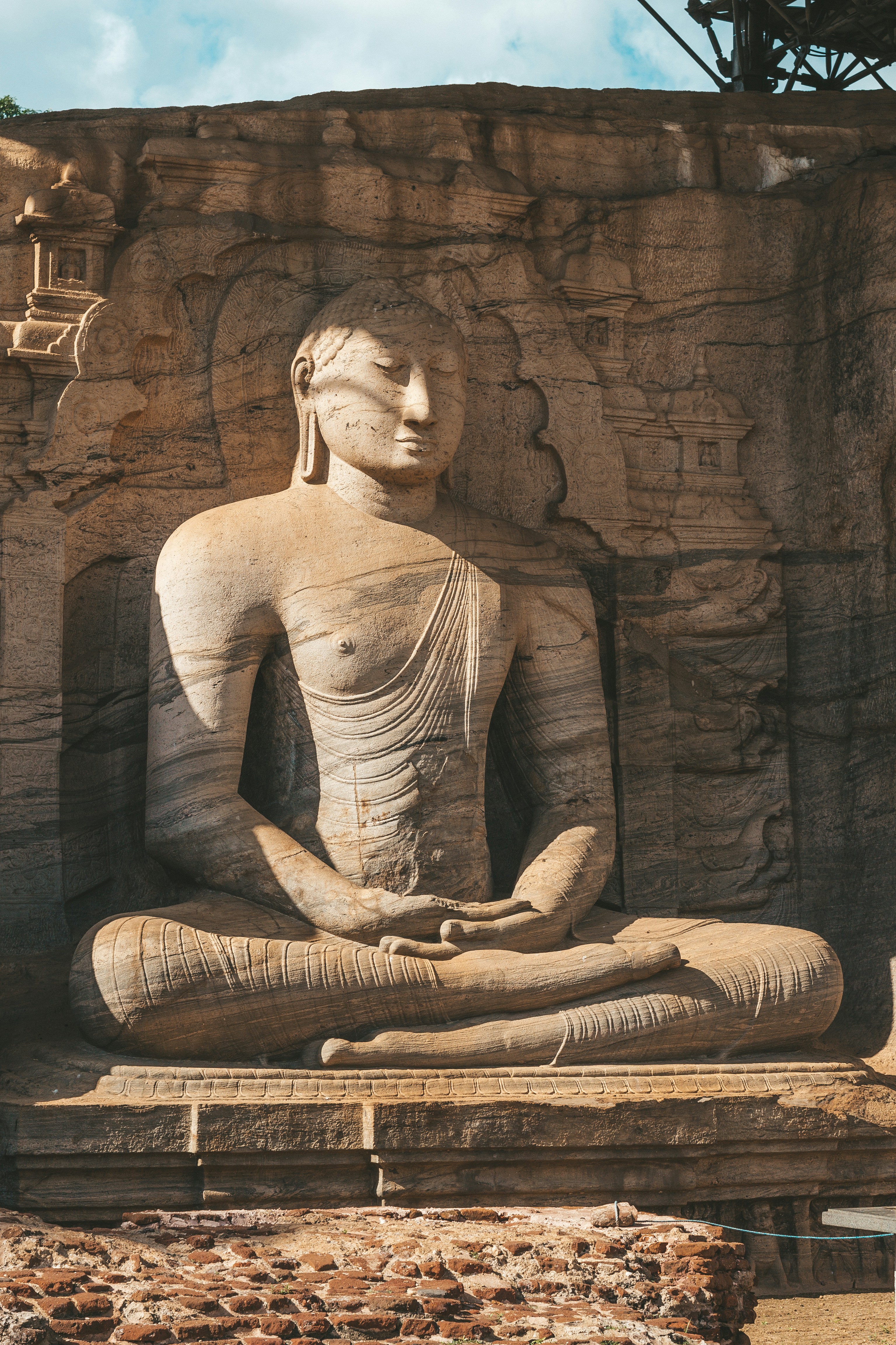 Seated Buddha statue carved in stone in Sri Lanka