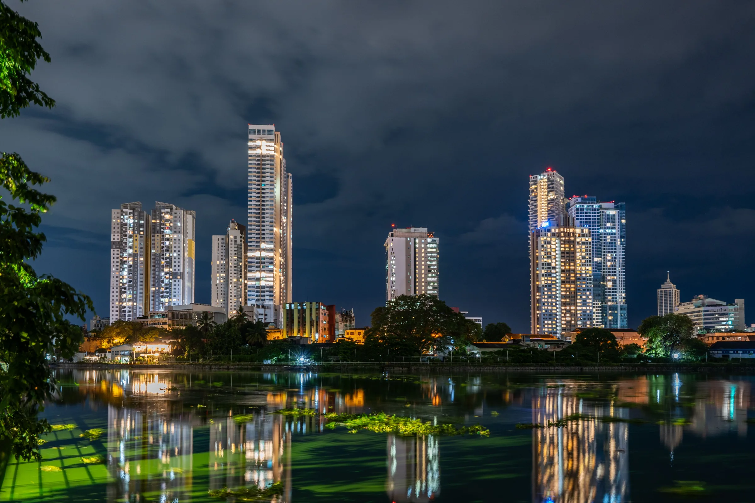 Colombo skyline illuminated beside the water at night