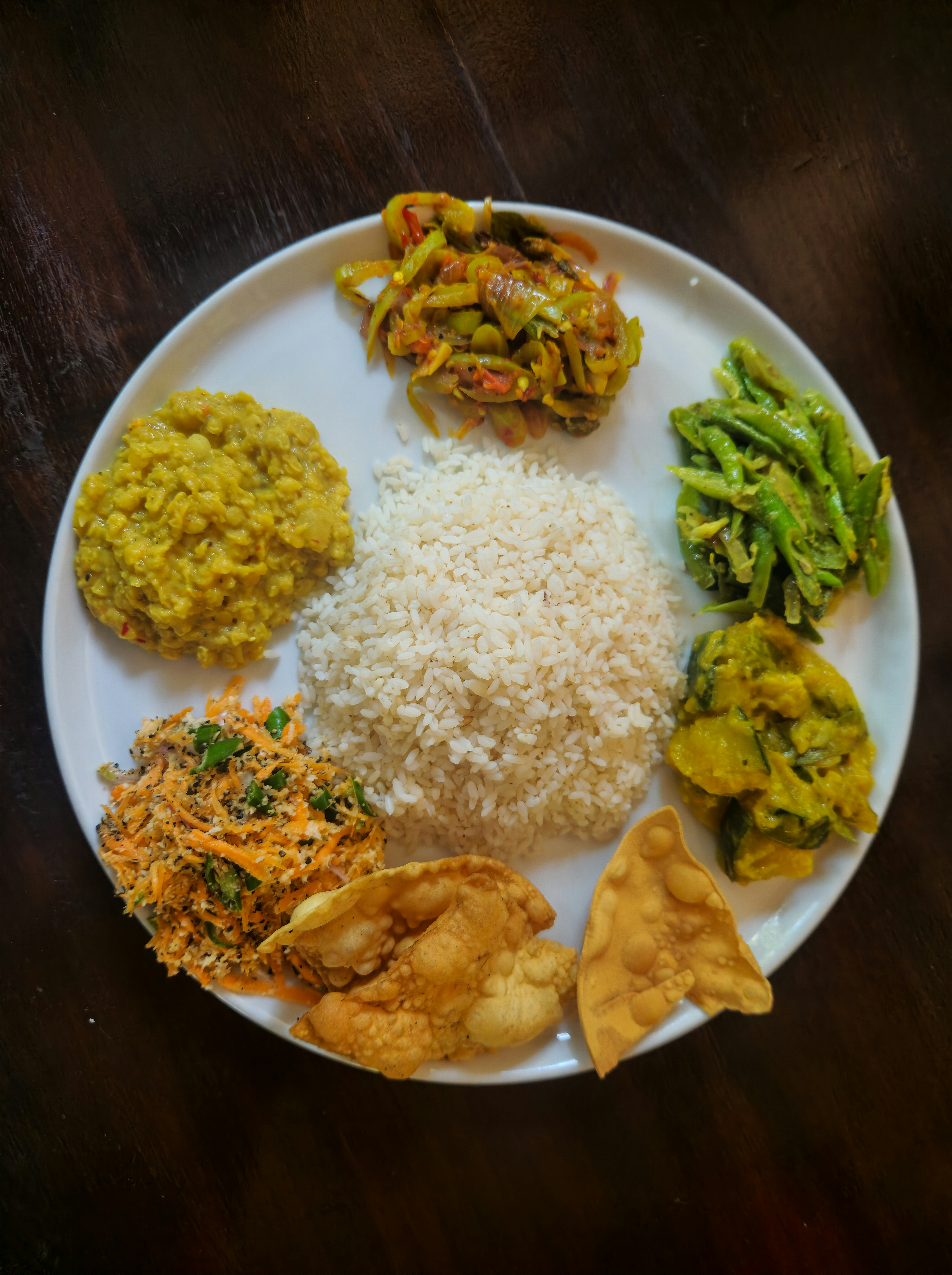 Sri Lankan rice and curry with dhal, vegetable curries and coconut sambol